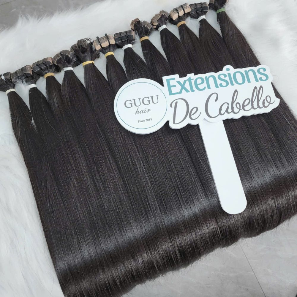 24 inch Vietnamese tape-in hair extensions in natural black color by GUGUHAIR